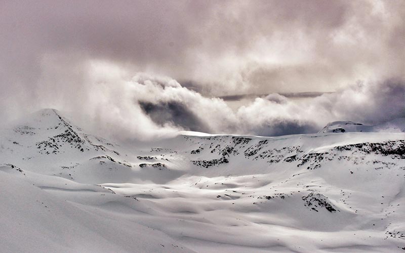 Fresh snow on untouched mountain peaks and ridges near the Mallard Mountain Lodge, BC