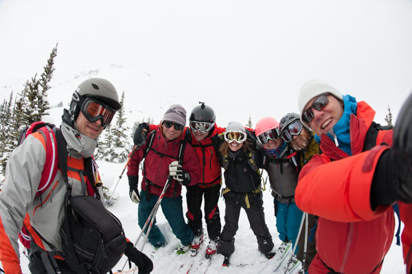 Ski touring guide and group on a day trip in the Canadian Rockies in BC