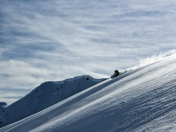 Man skiing powder at the Mallard Mountain Lodge