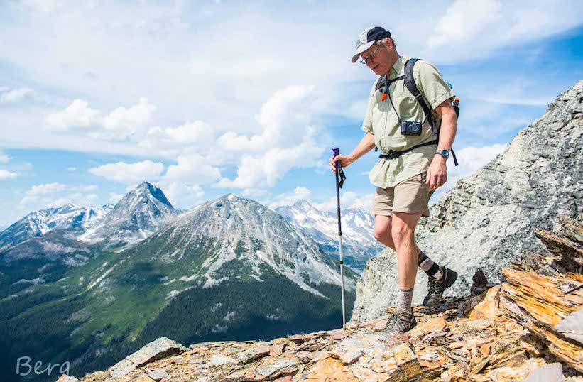 A man hiking the Canadian Rocky Mountains near the Mallard Mountian Lodge. 