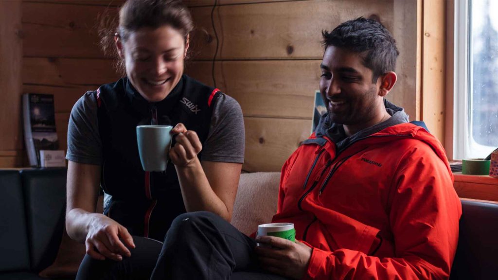 couple enjoying a coffee inside the mallard mountain lodge