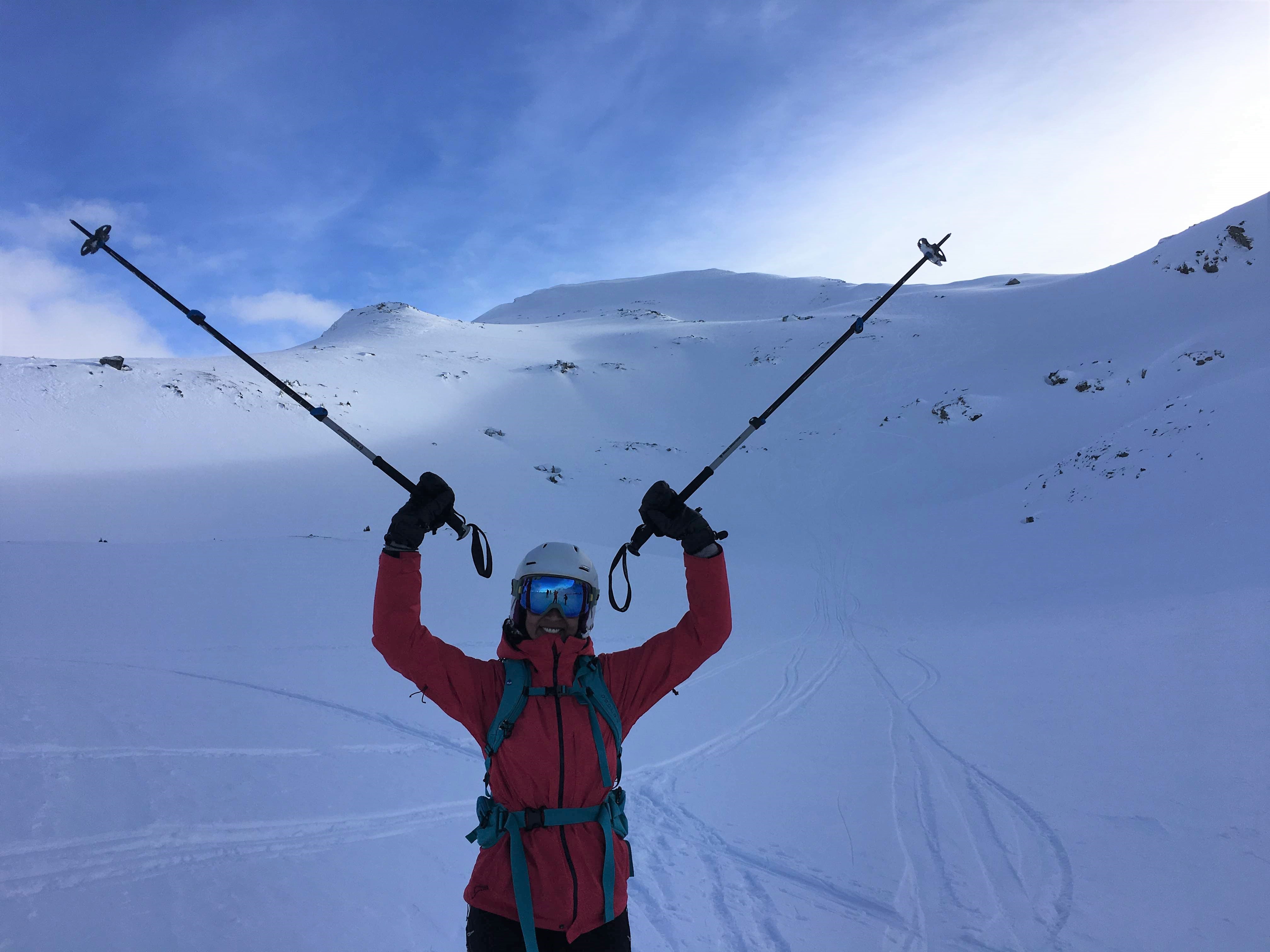 Happy skier at the end of a ski touring run - a great accomplishment