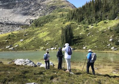 hikers at alpine lake and glacial cirque