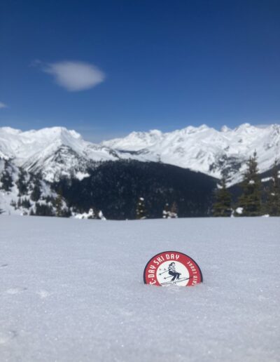 ski day button in snow